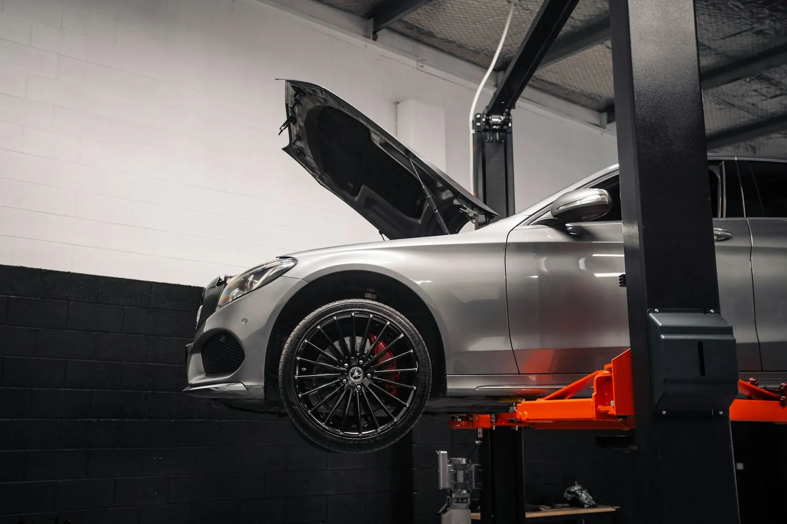 Car on a lift in a garage workshop