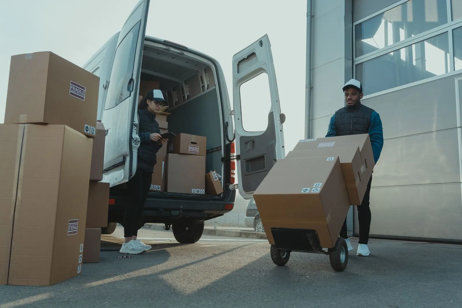 Team loading business stock into a van